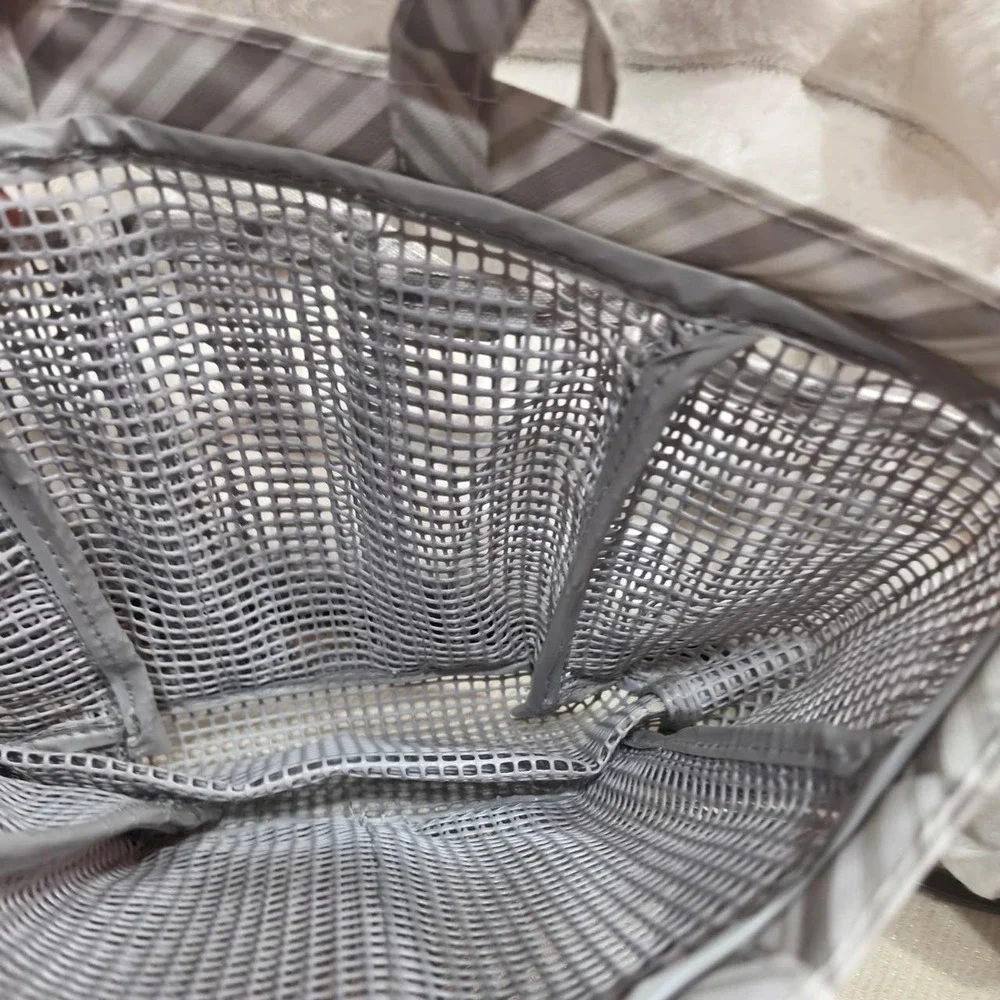 Grey striped mesh shower caddy with clear bottom